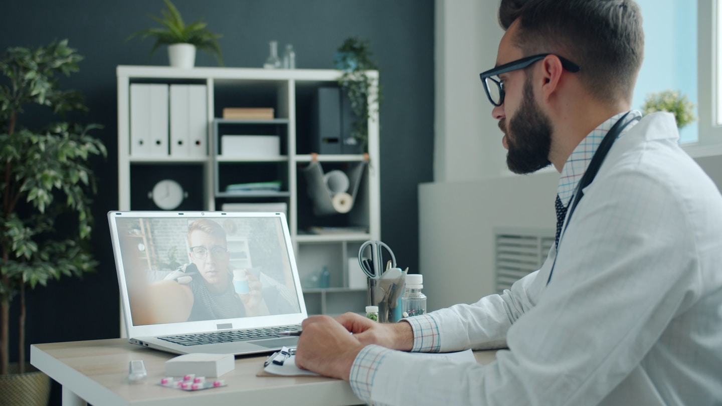 Doctor consulting with a patient during an online medical appointment